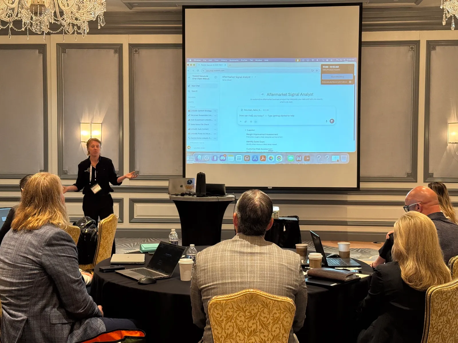 Lauren McCullough demonstrating Tromml Secure AI Chat to a room of aftermarket leaders